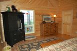 Master Bedroom with antique stained glass window overlooking mountain