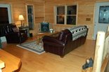 Upstairs Living Room with leather sofa and recliner, fireplace and handmade furniture